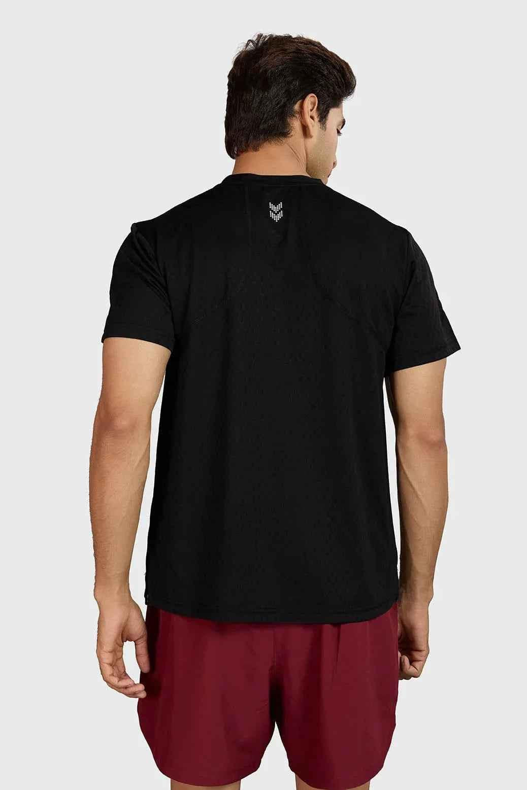 Black Motion Running T-shirt by Fuaark Nz, made of lightweight fabric with breathable design, suitable for athletic activities.