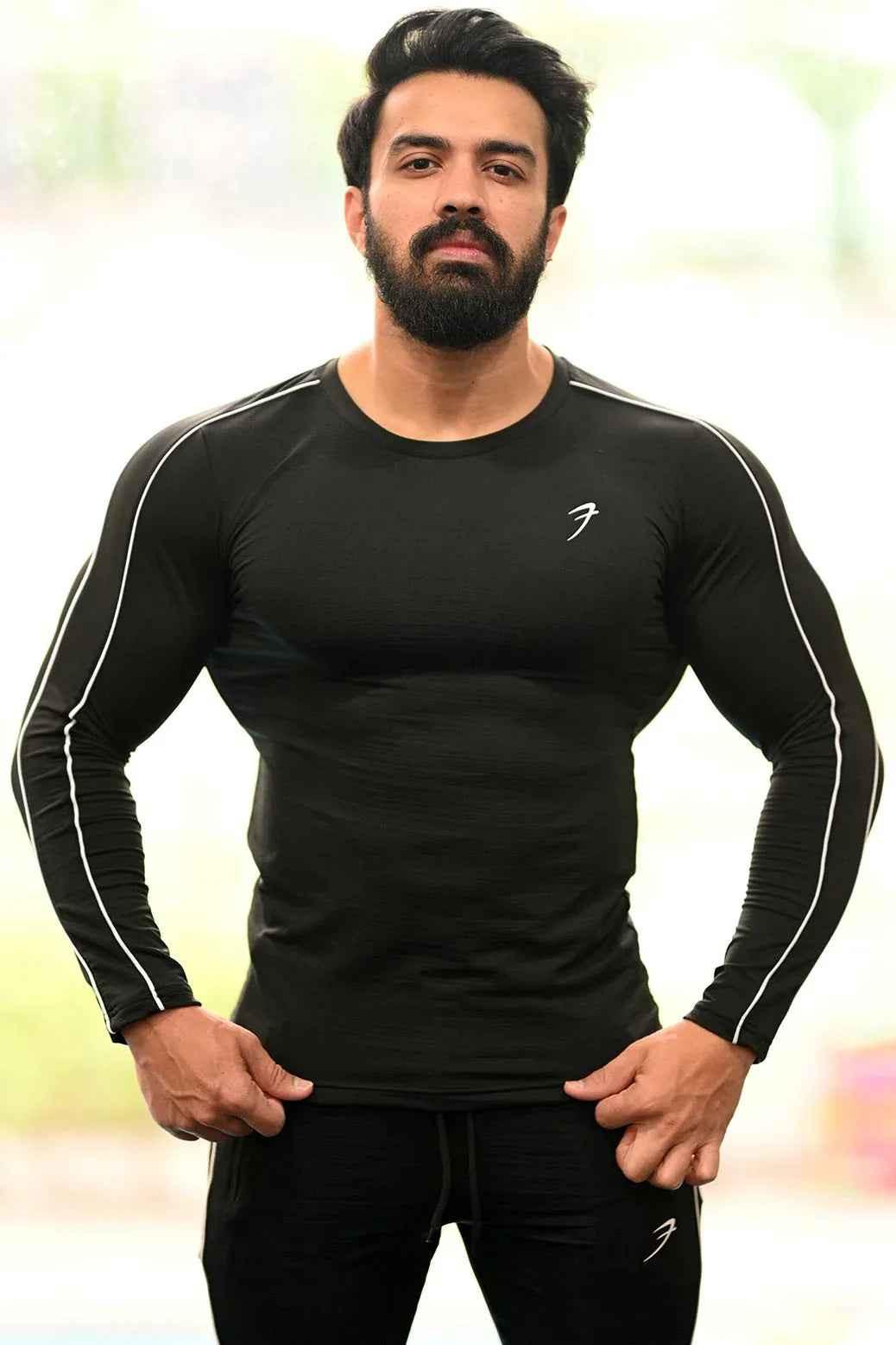 Black Revival Piping Fullsleeves T-shirt by Fuaark Nz, featuring piping details and a classic fit, displayed on a plain background.