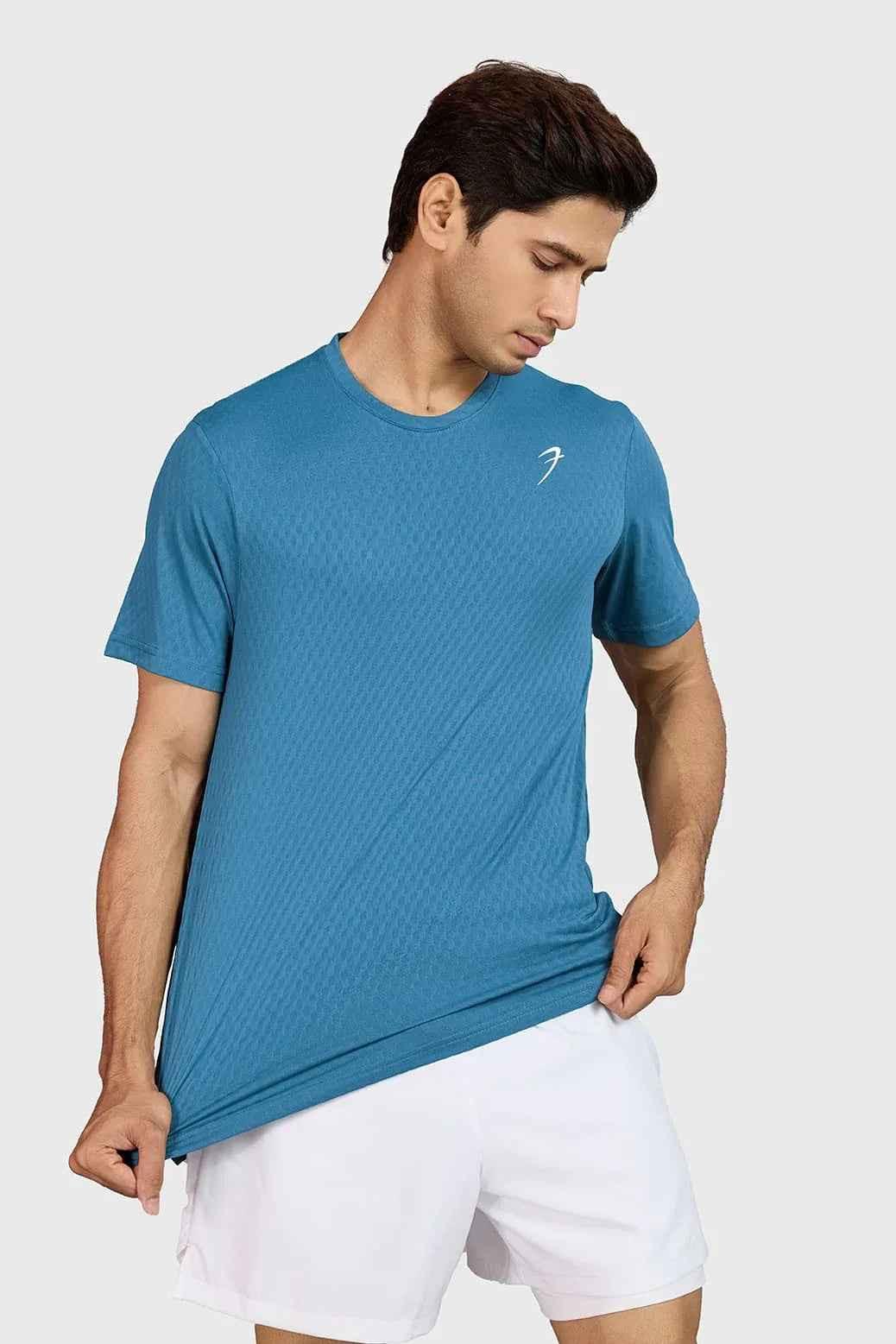 Teal Fuaark Nz motion running T-shirt made of lightweight, breathable fabric for comfortable active wear.