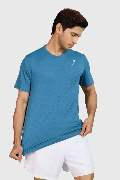 Teal Fuaark Nz motion running T-shirt made of lightweight, breathable fabric for comfortable active wear.