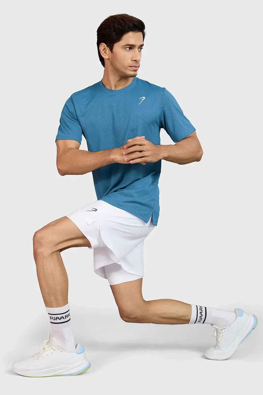 Teal Fuaark Nz motion running T-shirt, lightweight breathable performance gear for ultimate comfort, shown on a model.