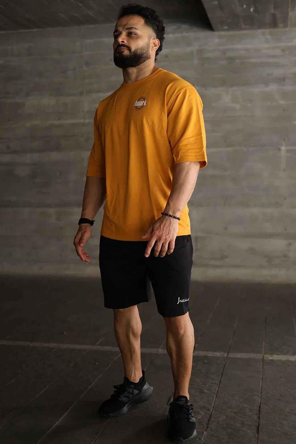 Fuaark Nz Zodiac oversized mustard T-shirt featuring bold zodiac print and relaxed fit, casual streetwear style.