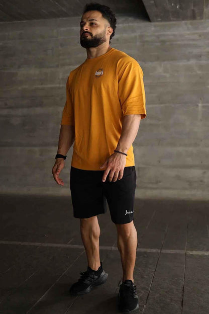 Fuaark Nz Zodiac oversized mustard T-shirt featuring bold zodiac print and relaxed fit, casual streetwear style.