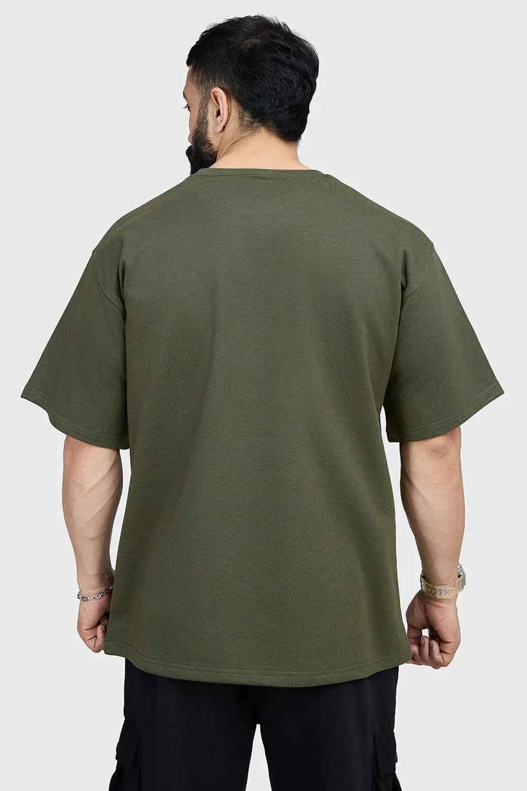 Olive green oversized T-shirt from Fuaark Nz, made of soft fabric, casual fit, perfect for effortless style.