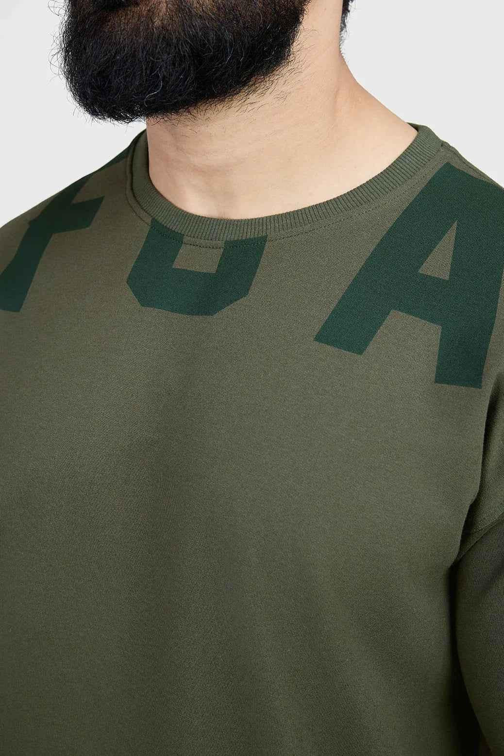 Fuaark Nz oversized olive T-shirt for women, relaxed fit with soft fabric, casual style, perfect for effortless everyday wear.