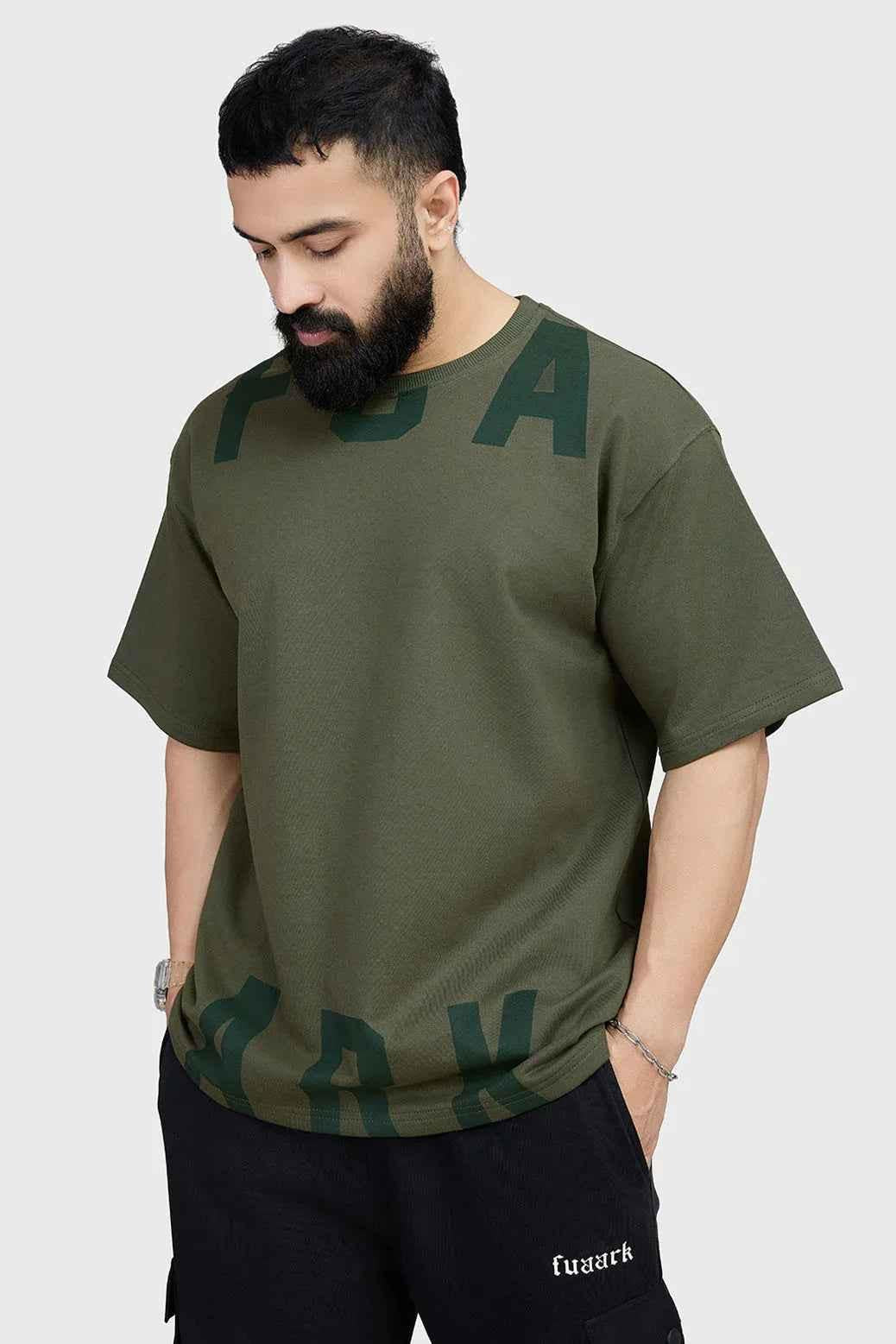 Olive oversized T-shirt by Fuaark Nz, made from soft fabric, featuring a relaxed fit and casual style.