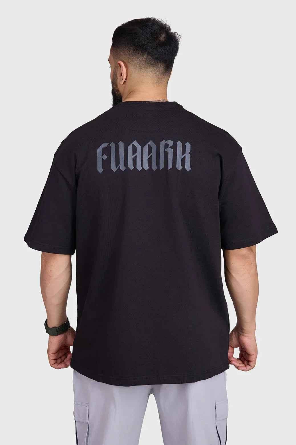 Fuaark Nz oversized black T-shirt for men, casual fit, soft fabric, stylish and comfortable for everyday wear.