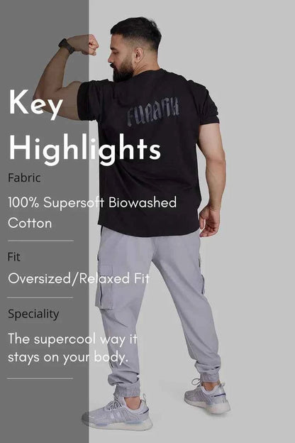 Oversized black T-shirt by Fuaark Nz with a relaxed fit, perfect for comfort and casual style.