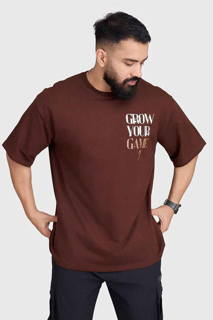 Unisex oversized coffee-colored T-shirt from Fuaark Nz featuring a relaxed fit and casual style.