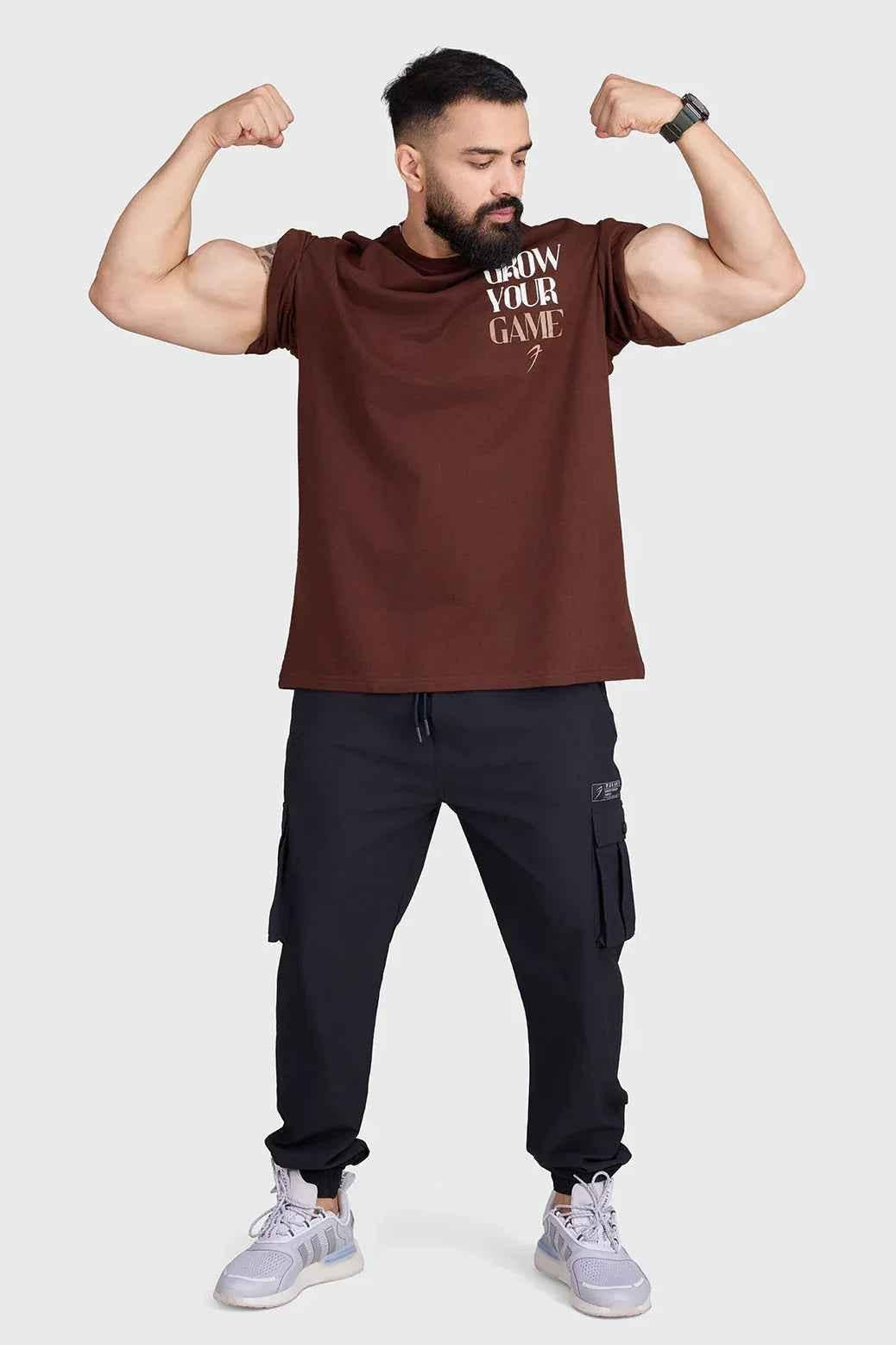 Unisex oversized coffee-colored T-shirt by Fuaark Nz, made for ultimate comfort, shown on a model with relaxed fit.