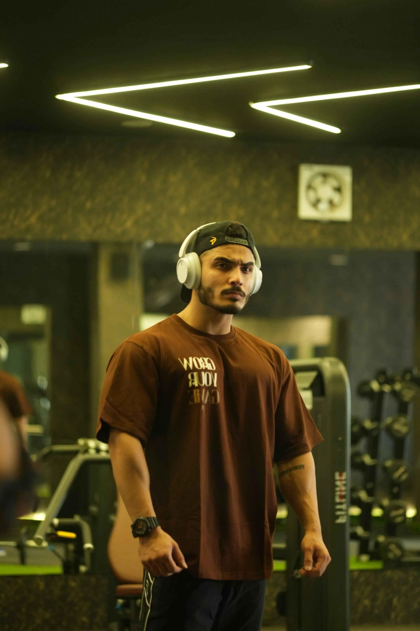 Unisex oversized coffee-colored T-shirt by Fuaark Nz, featuring a relaxed fit and casual style for ultimate comfort.
