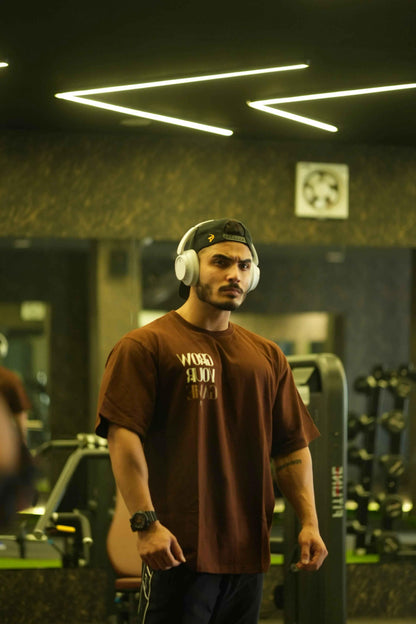 Unisex oversized coffee-colored T-shirt by Fuaark Nz, featuring a relaxed fit and casual style for ultimate comfort.