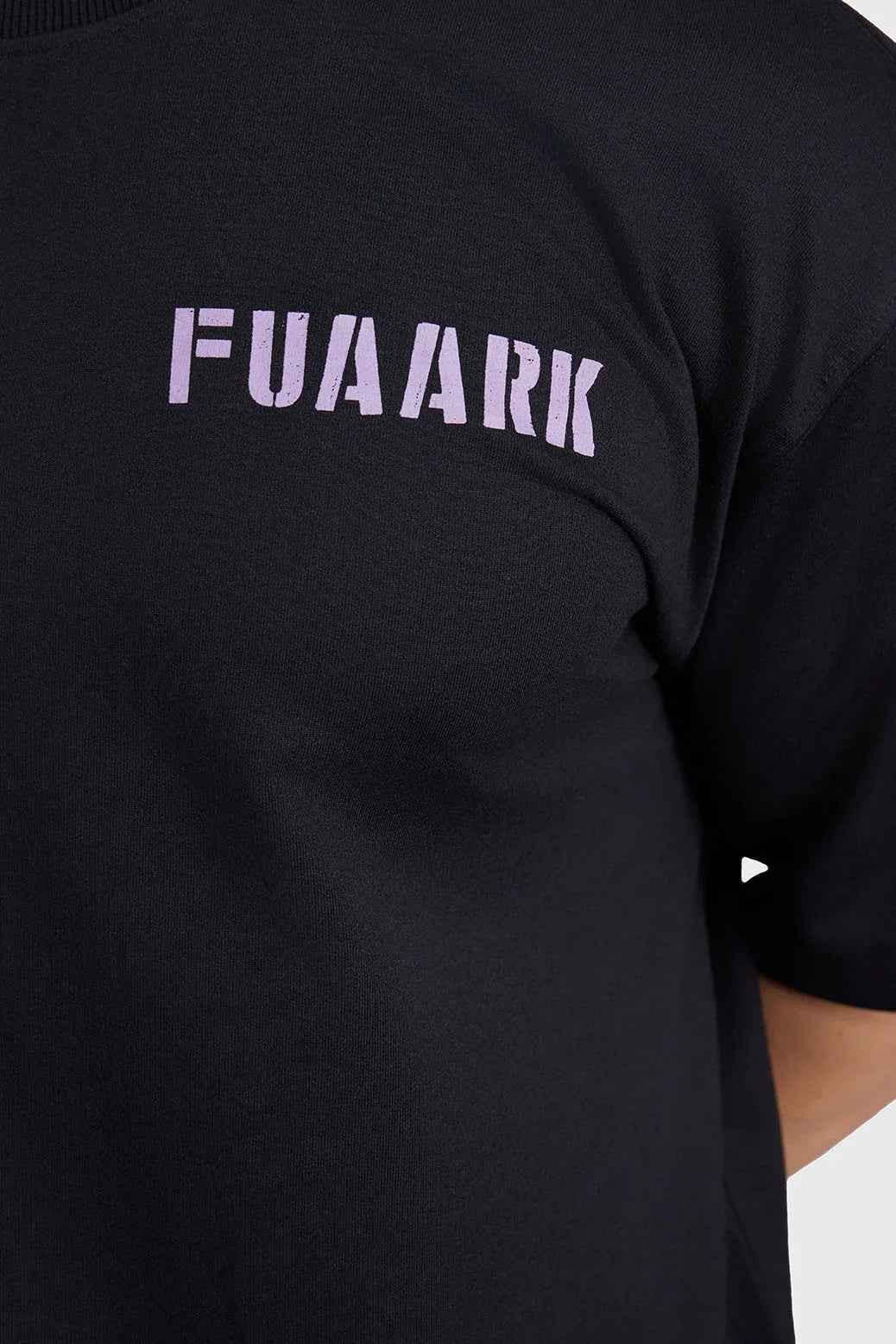 Unisex oversized black rage T-shirt by Fuaark Nz, soft fabric, relaxed fit, casual streetwear style, shown on a model.