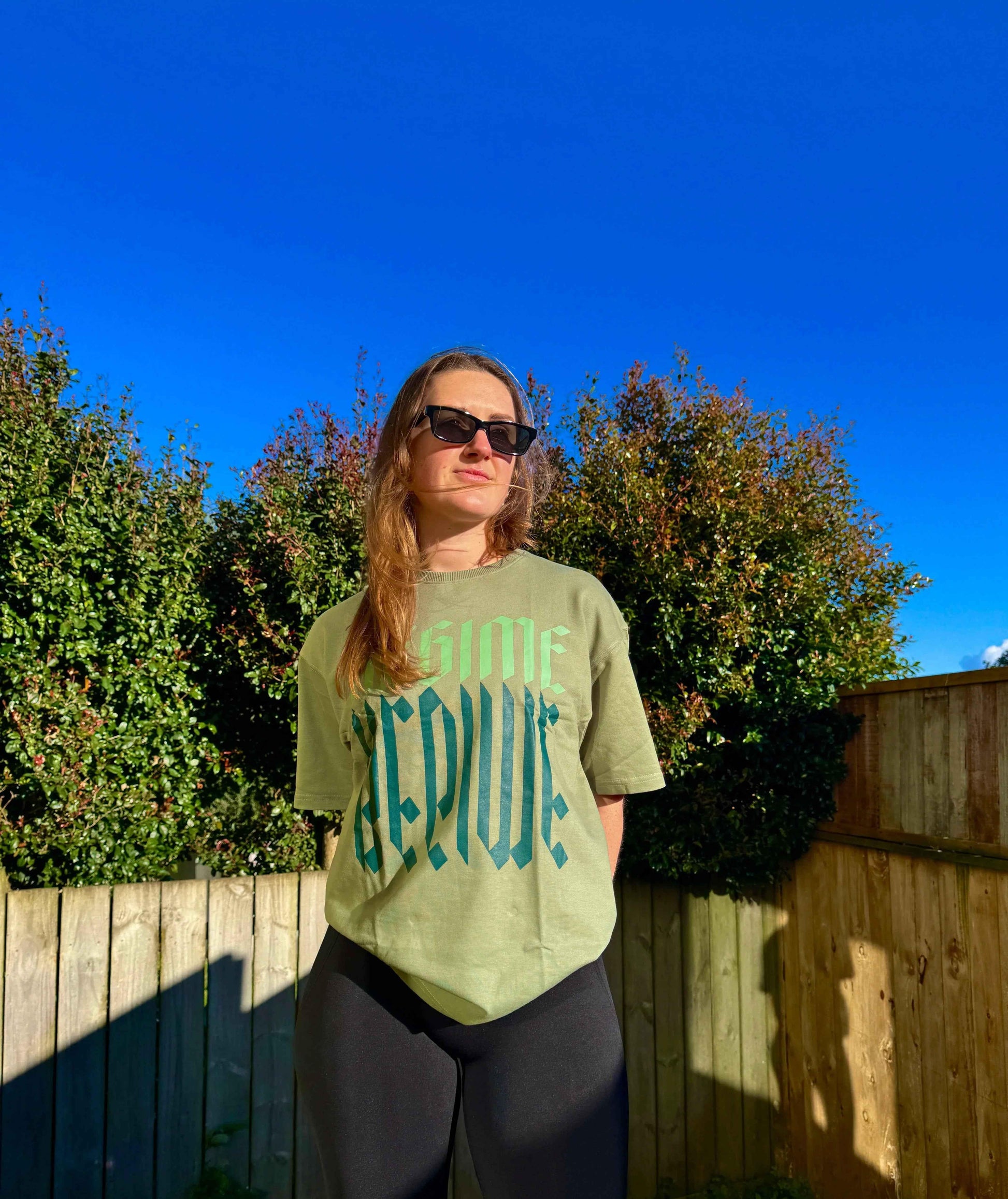 Unisex oversized Sage Green T-shirt by Fuaark Nz featuring a relaxed fit and casual style.
