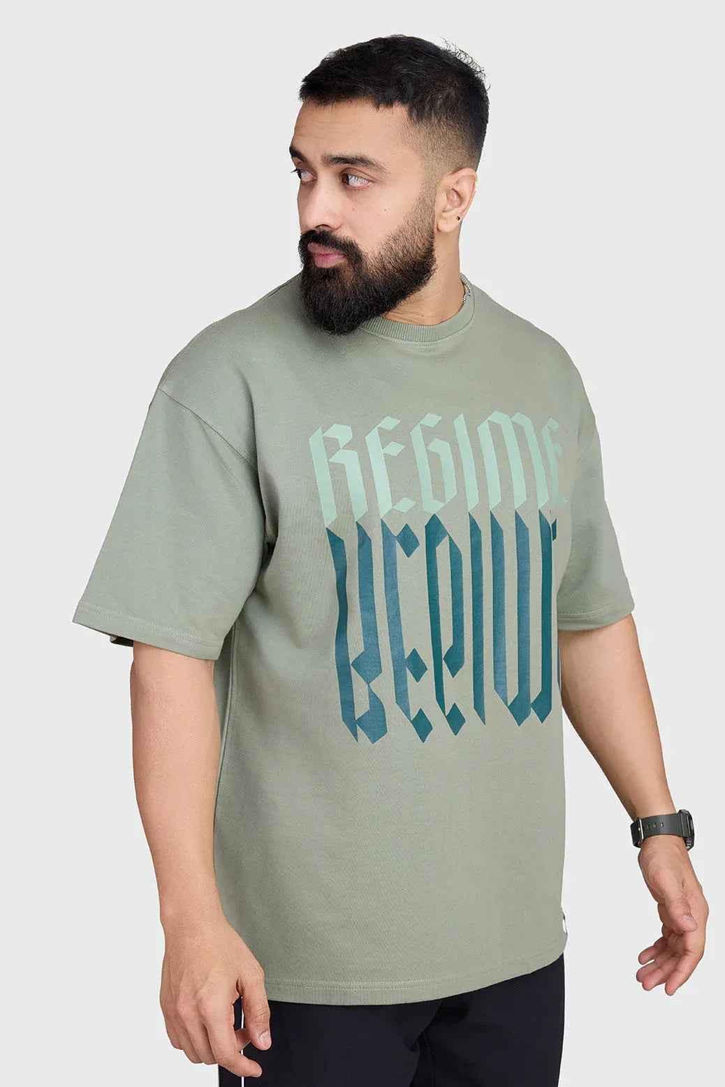 Unisex oversized T-shirt in sage green from Fuaark Nz, featuring a relaxed fit and casual style.