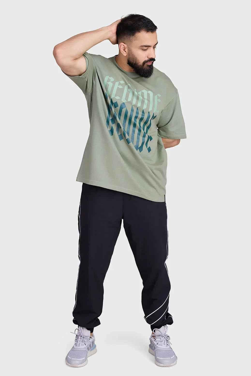 Unisex Sage Green Oversized T-shirt by Fuaark Nz, featuring a relaxed fit and soft fabric, ideal for casual wear.