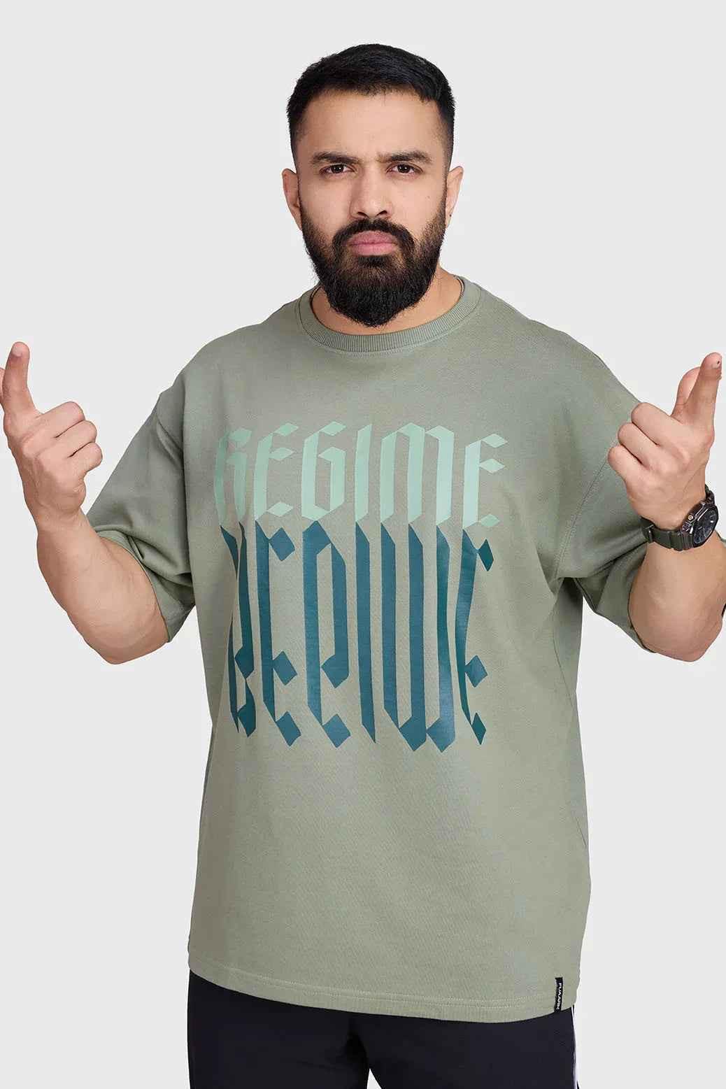 Unisex oversized sage green T-shirt by Fuaark Nz, featuring a relaxed fit and casual style.
