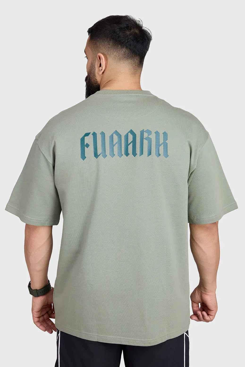 Unisex oversized T-shirt by Fuaark NZ in sage green, featuring a relaxed fit and casual style.