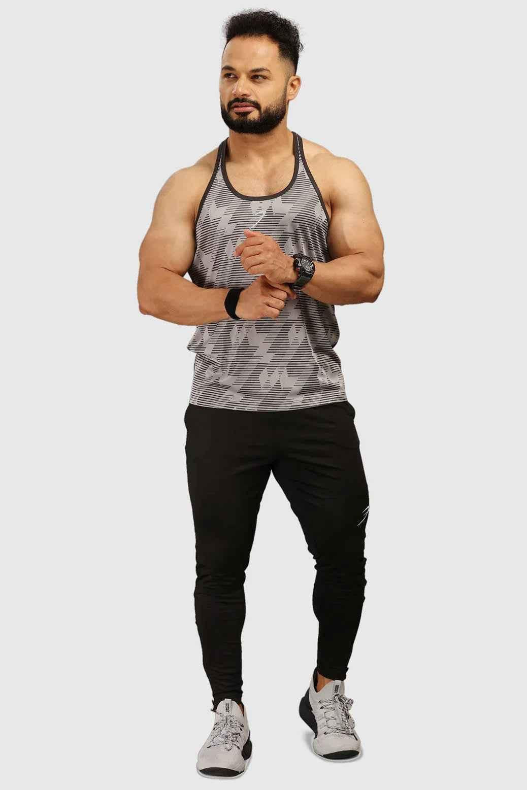 Light grey Amplify Stringer tank top by Fuaark Nz, sleeveless athletic shirt with fitted style and breathable fabric.