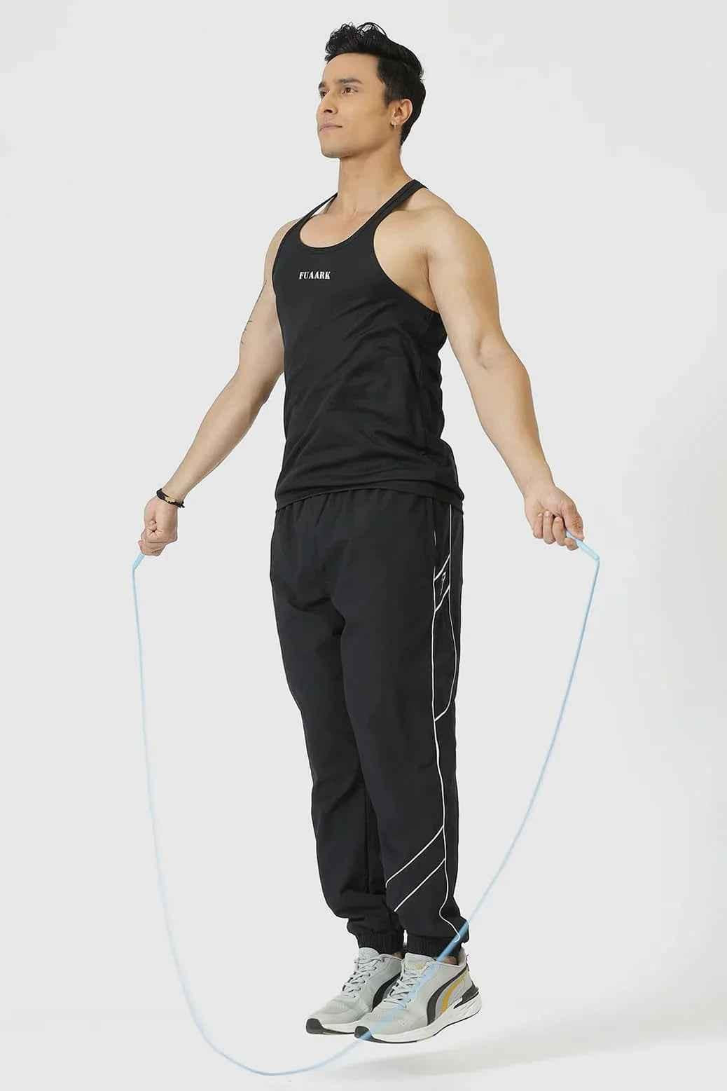 Black Checks Stringer Tank Top by Fuaark Nz, featuring a fitted sleeveless design with checkered pattern and scoop neckline.