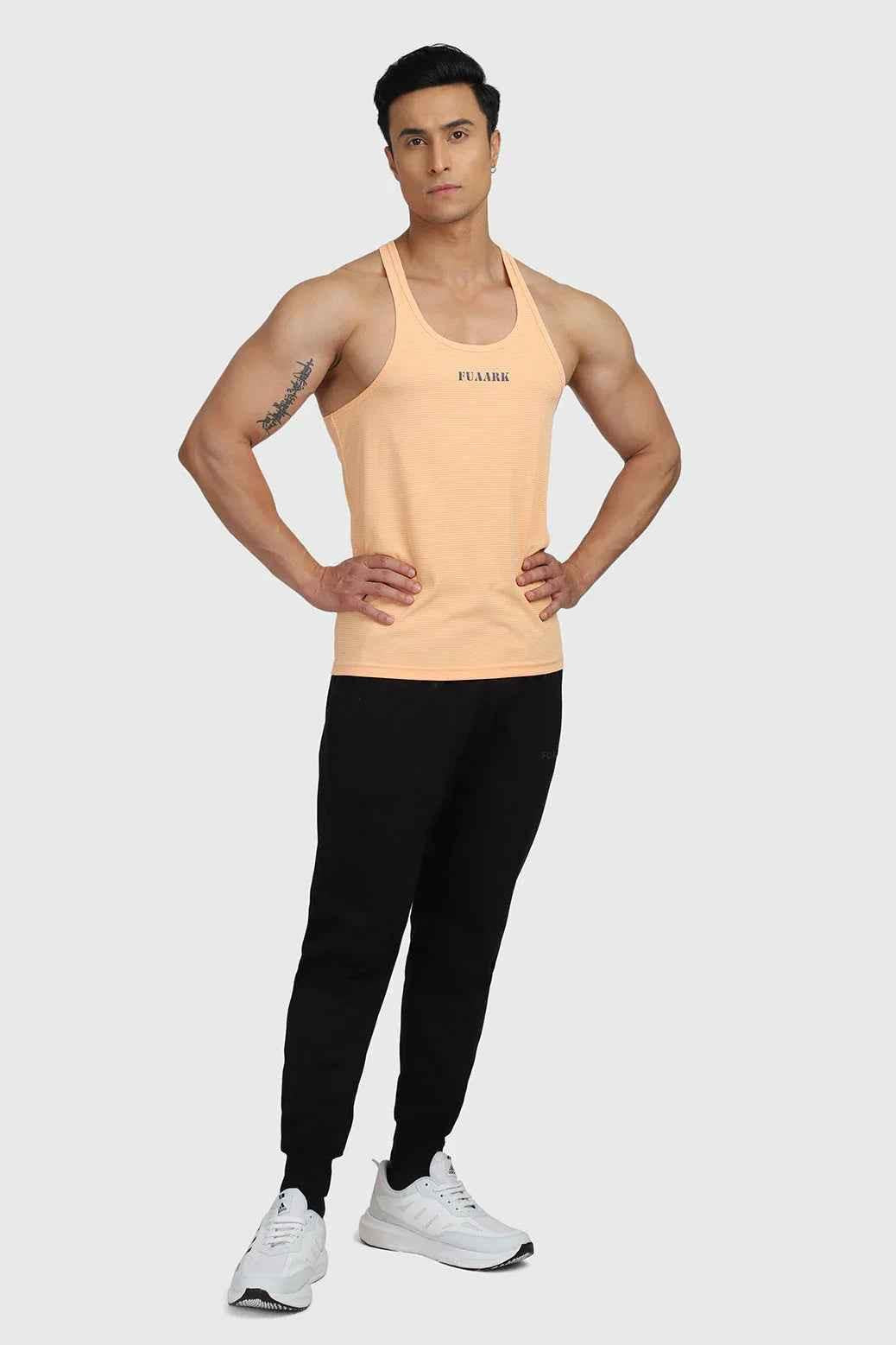 Fuaark Nz Checks Stringer Peach tank top featuring a peach-colored sleeveless design with checkered pattern.