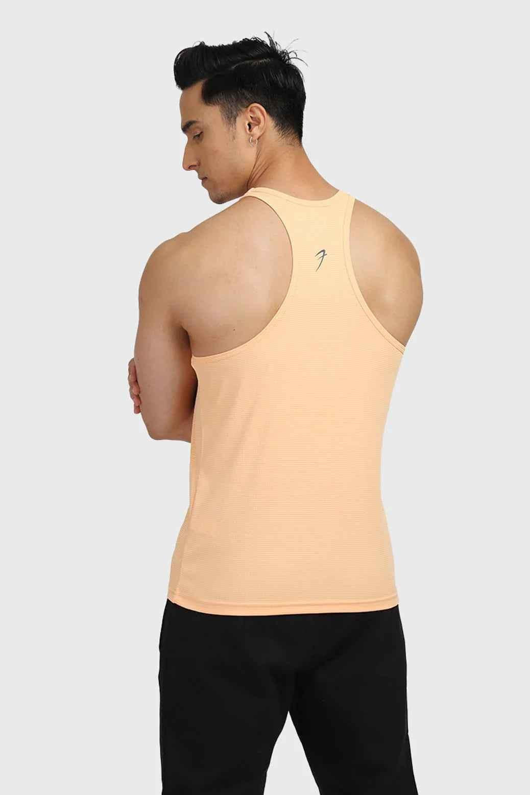Fuaark Nz Checks Stringer Peach tank top featuring a peach-colored checkered design, sleeveless style, and fitted fit.