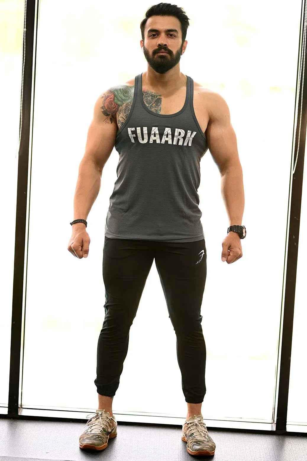 Grey Classic Stringer tank top by Fuaark Nz, showing a sleeveless athletic style with a fitted design.