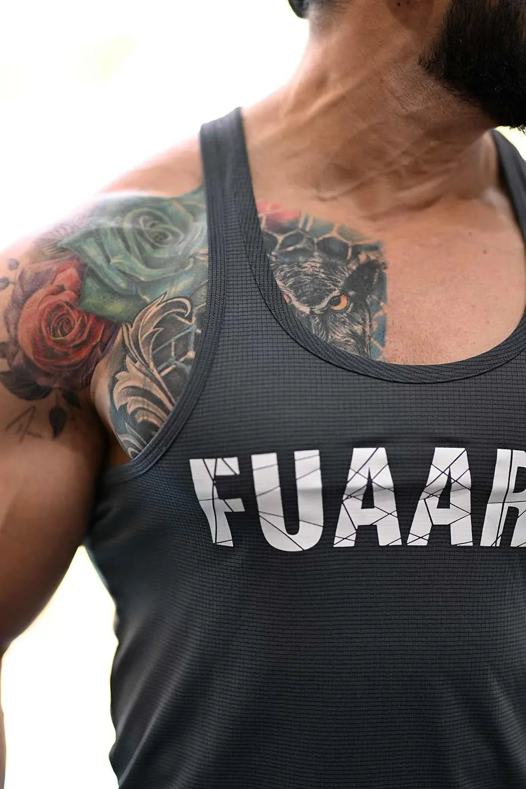 Grey Classic Stringer tank top by Fuaark Nz, featuring a fitted design and sleeveless style for athletic or casual wear.