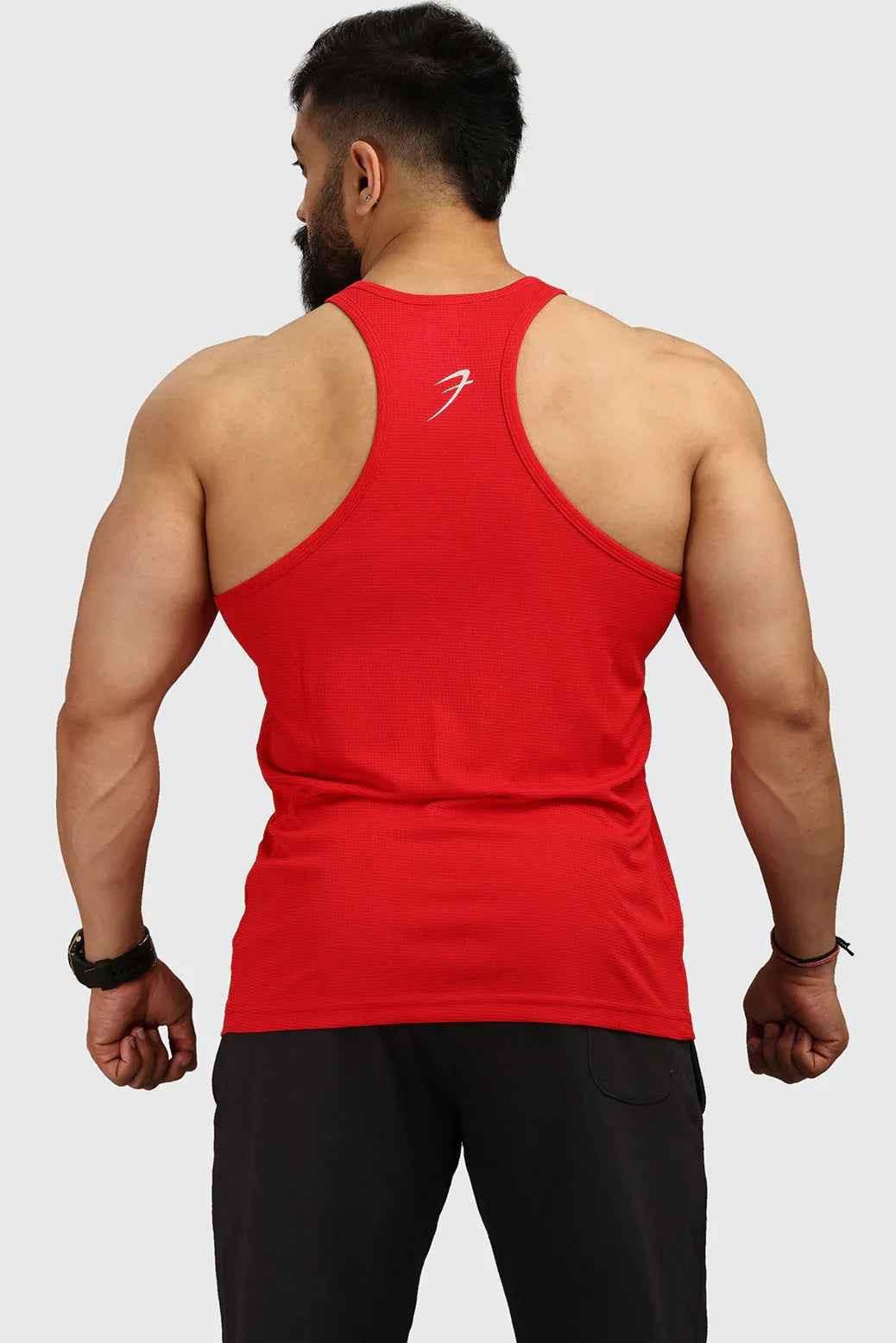 Red Classic Stringer Tank Top by Fuaark Nz, sleeveless athletic shirt with a fitted design and minimalist style.