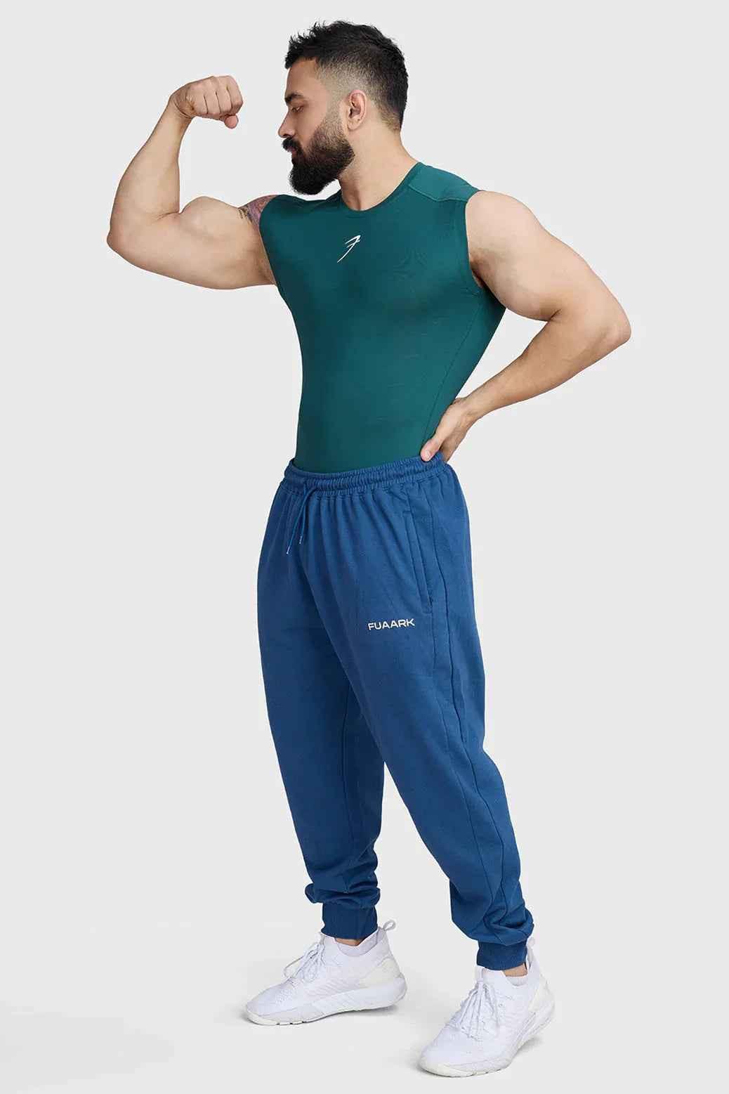 Emerald green compression sleeveless tank top by Fuaark Nz, fitted athletic tank top for workout and active wear.