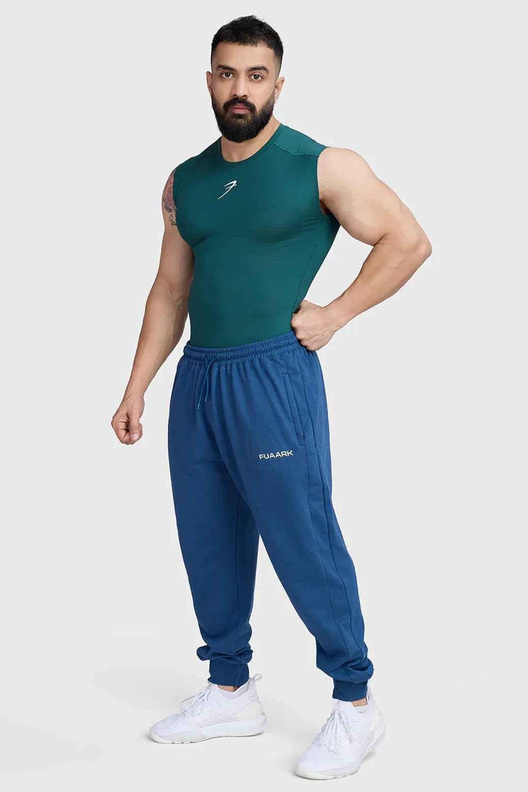 Emerald green Fuaark Nz compression sleeveless tank top, fitted athletic tank top for workouts and active wear.