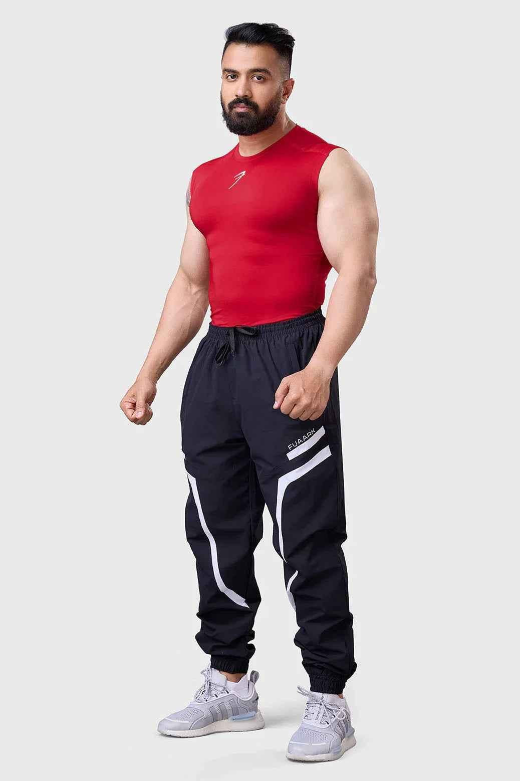 Red compression sleeveless tank top by Fuaark Nz, designed for performance, with a snug fit and breathable fabric.