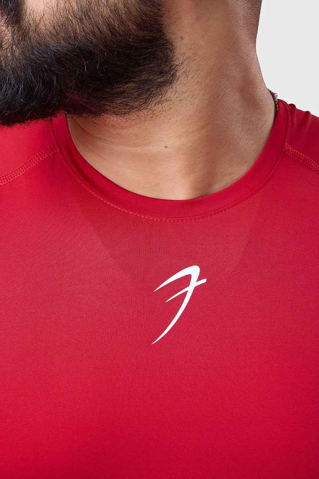 Red Fuaark Nz compression sleeveless tank top for ultimate performance, shown on a model with a fitted athletic fit.