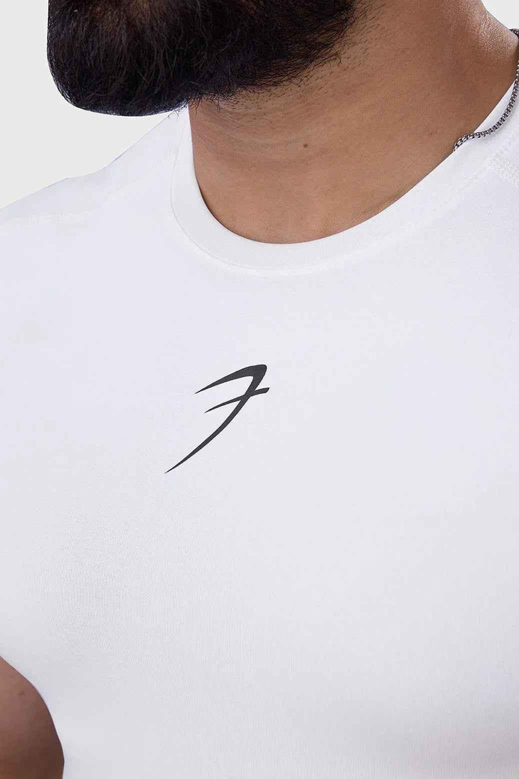 White compression sleeveless tank top by Fuaark Nz, designed for performance and athletic wear.
