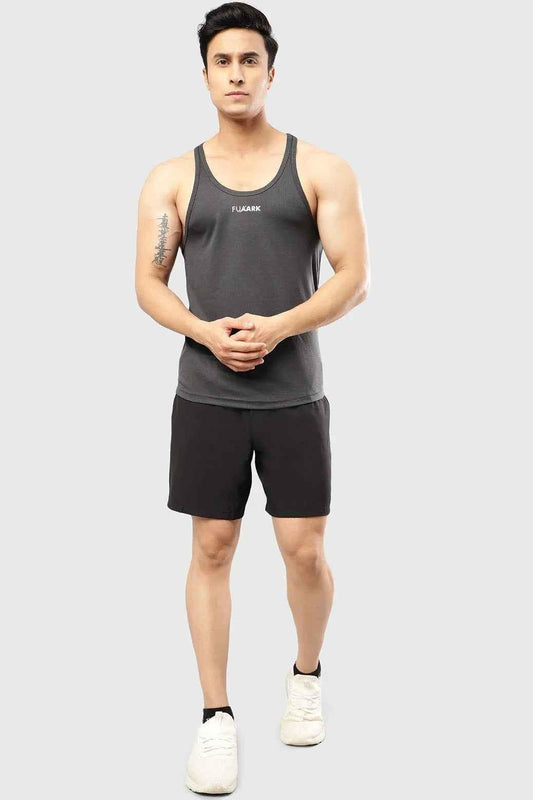 Dark grey mesh stringer tank top by Fuaark Nz, showcasing lightweight fabric and stylish fit for ultimate comfort and style.
