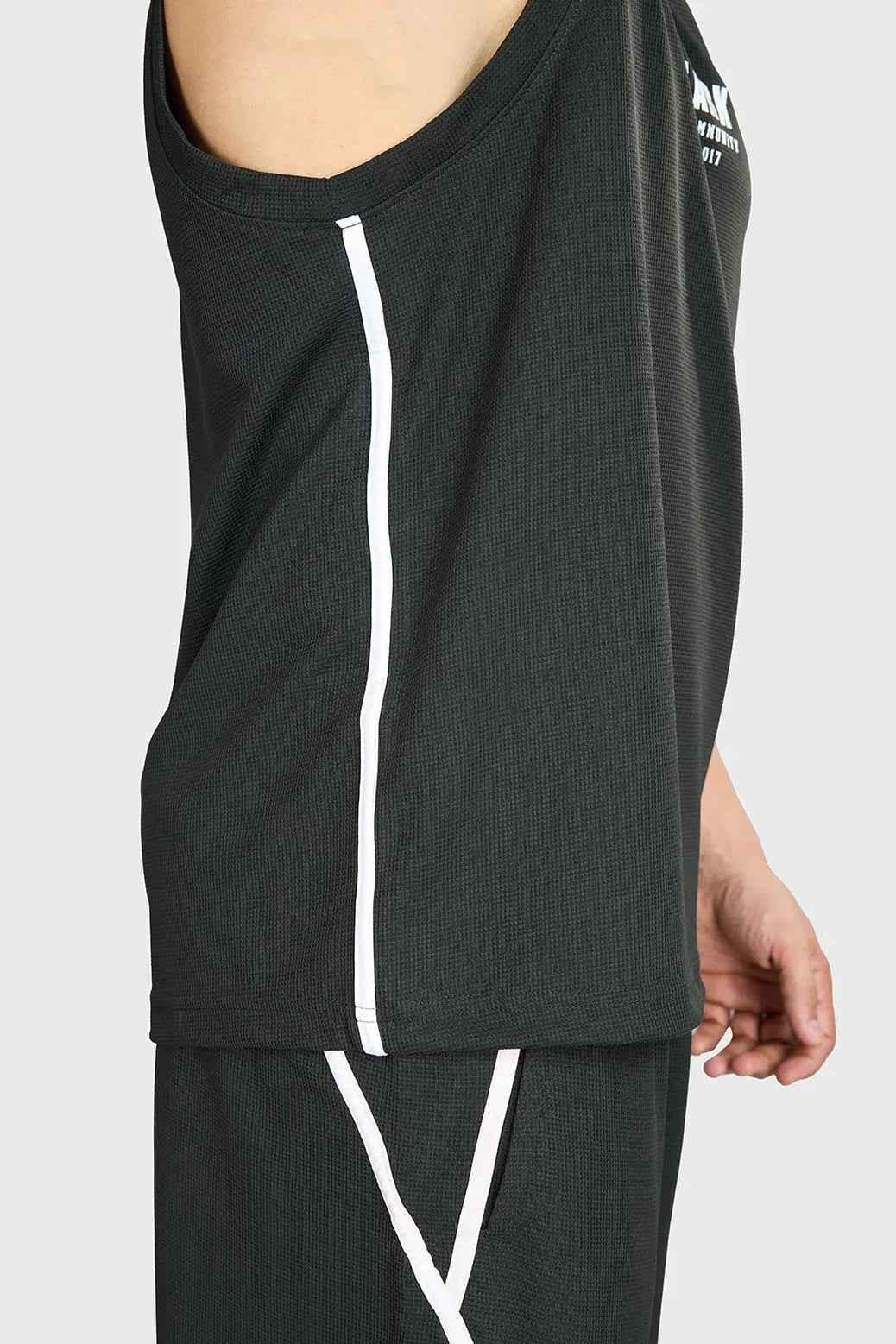 Fuaark Nz drip olive oversized tank top made of soft, breathable cotton with a relaxed fit, shown on a model.