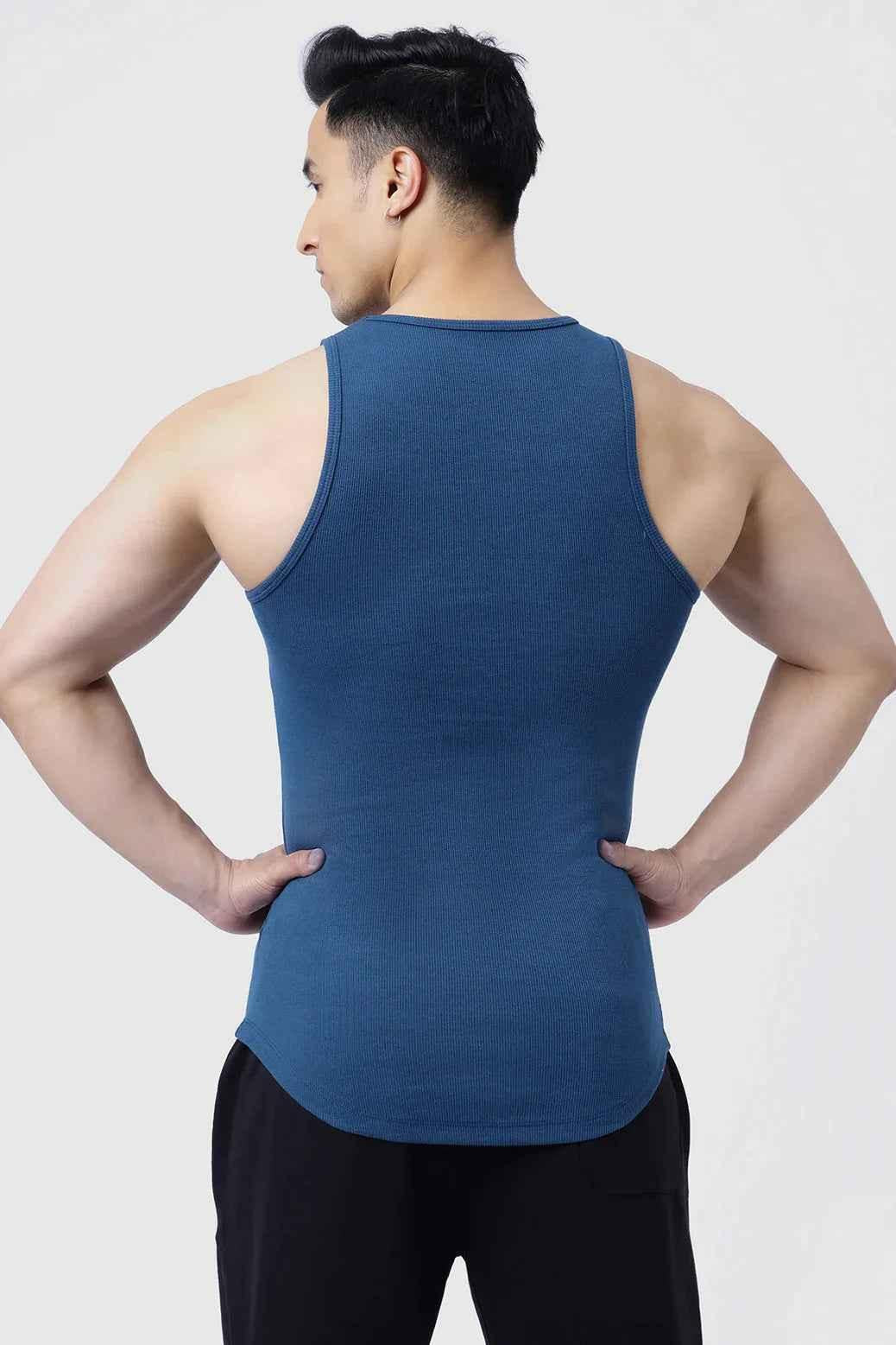 Fuaark Nz men's teal ribbed tank top displayed on a model, showcasing its fitted style and textured fabric.