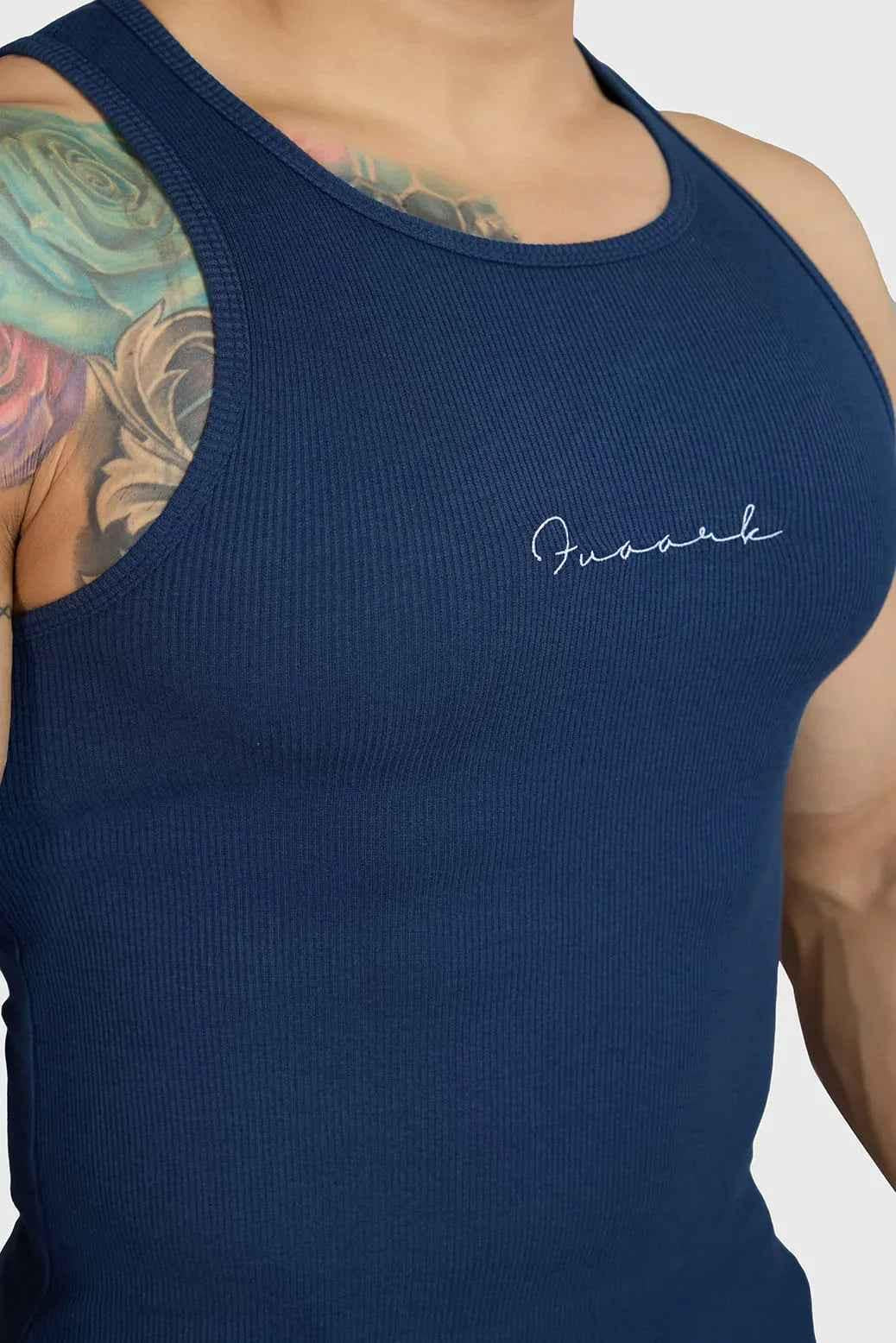 Fuaark Nz ribbed navy tank top displayed on a hanger, showcasing its fitted sleeveless design and soft fabric for everyday wear.