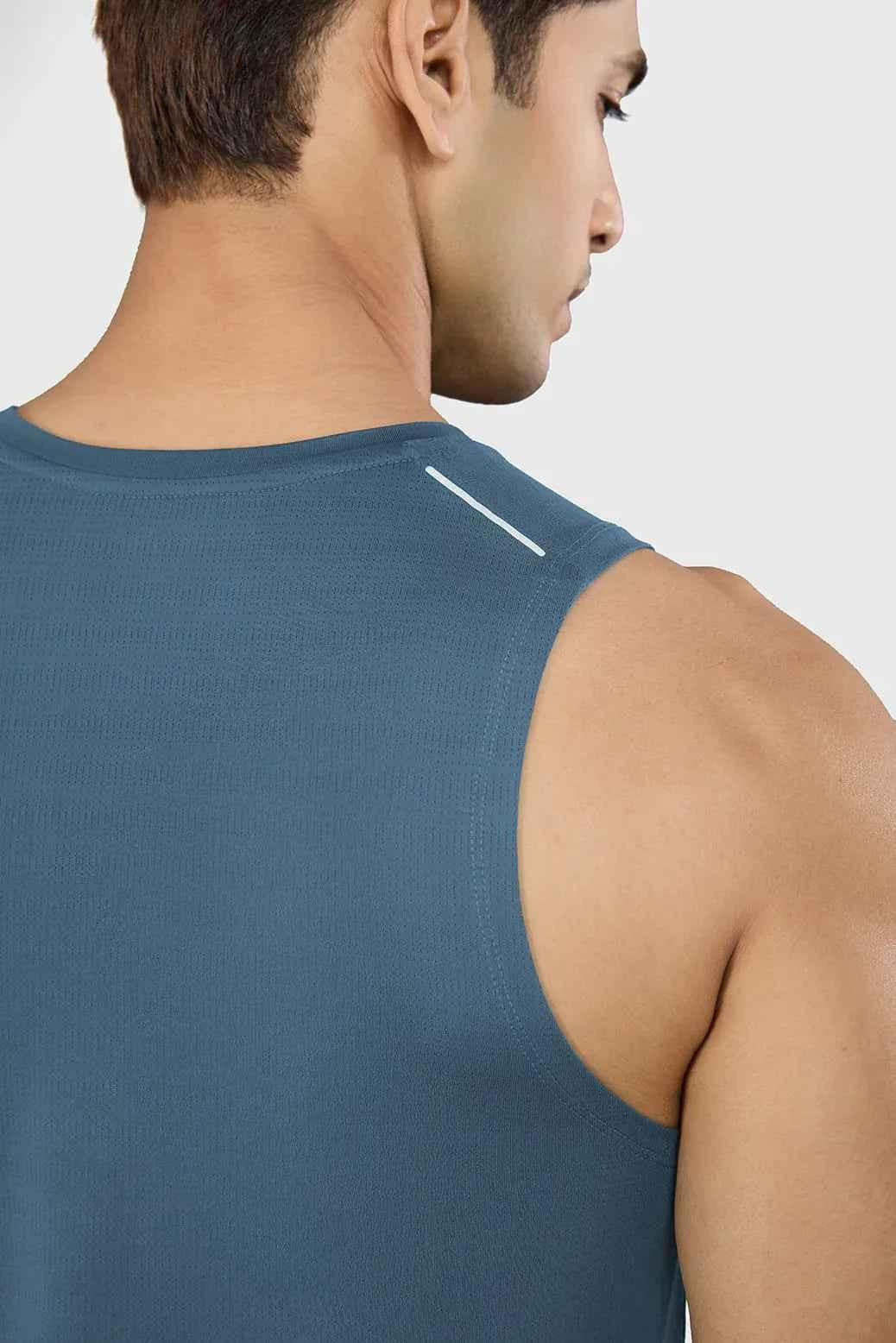 Light blue Ember Running Tank top by Fuaark NZ, sleeveless athletic tank with breathable fabric for active wear.