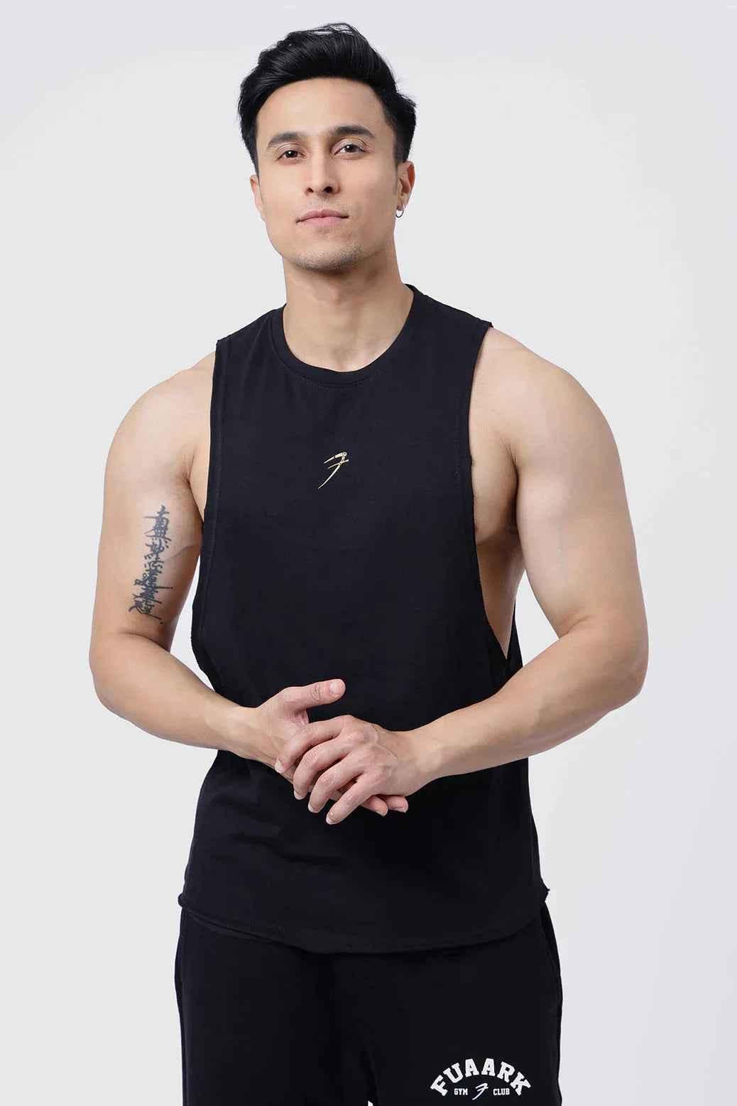Fuaark Nz Drift Black Deep Cut Muscle Tank with deep armholes and moisture-wicking fabric, designed for athletic performance.