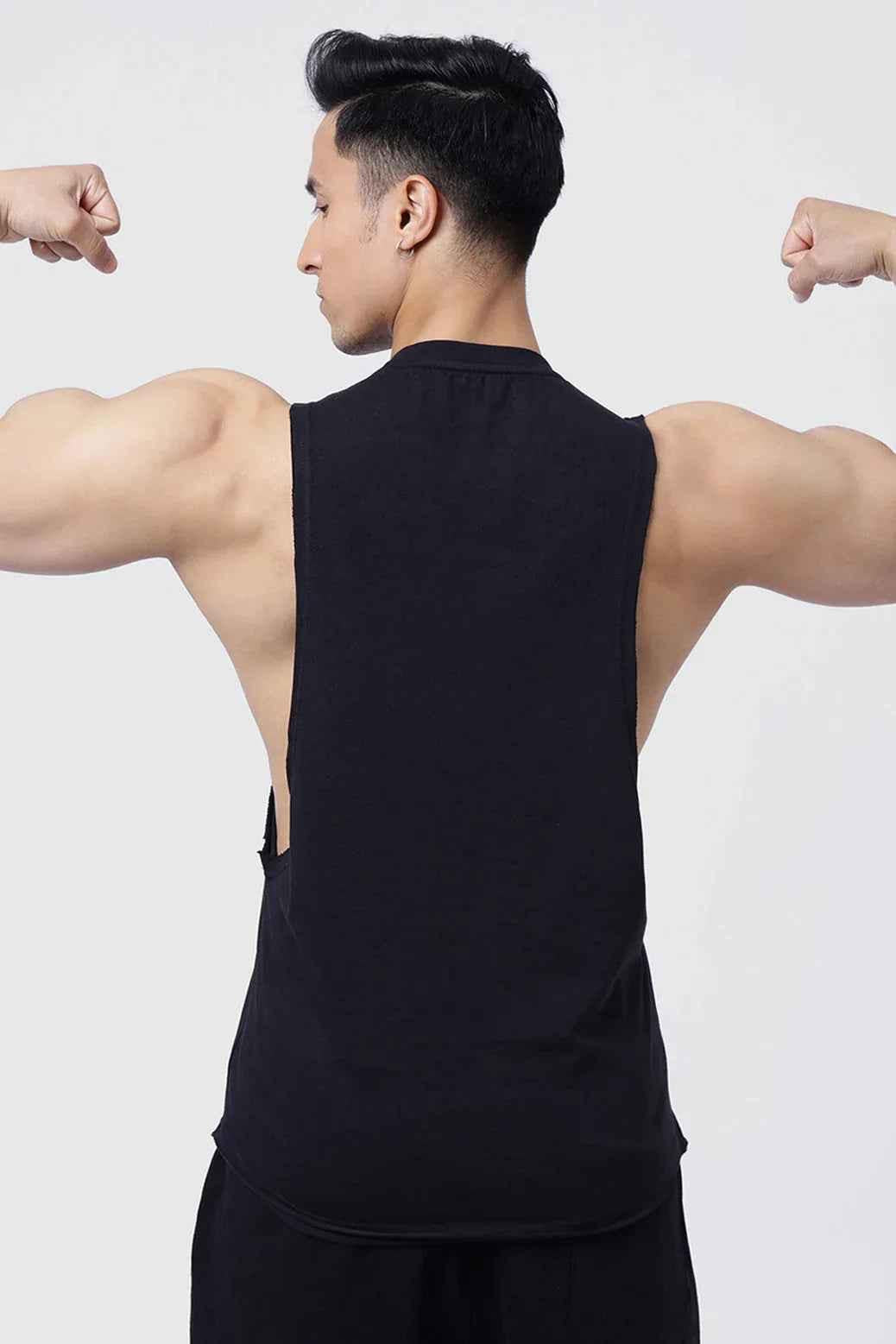 Fuaark Nz Drift Black Deep Cut Muscle Tank with deep armholes and moisture-wicking fabric, designed for active wear.