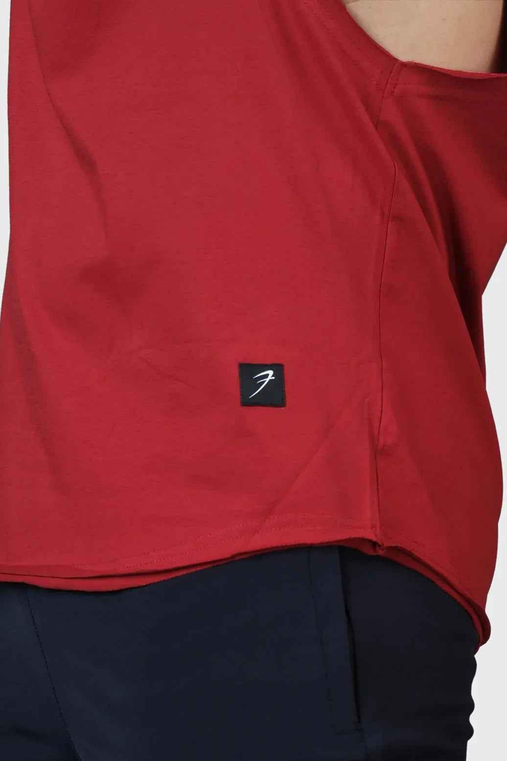 Fuaark Nz Legacy DeepArm tank top in maroon, stylish and comfortable activewear for women, shown on a model.