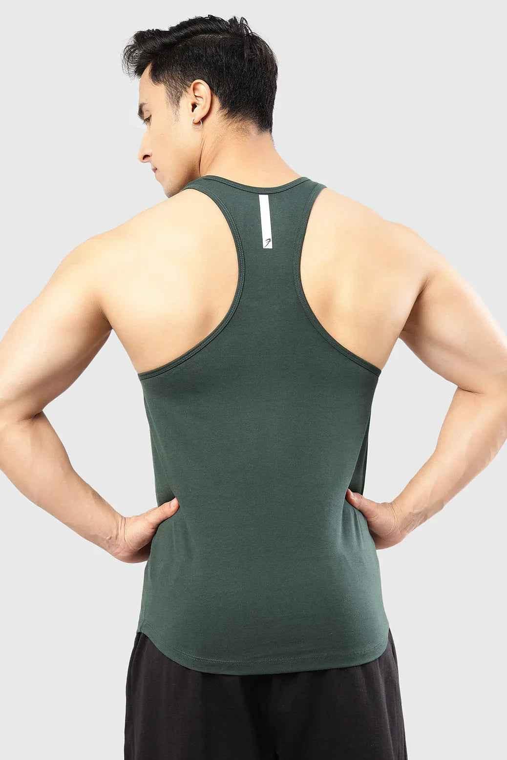 Fuaark Nz Legacy Stringer Tank Top in Bottle Green, sleeveless athletic shirt with fitted design and lightweight fabric.