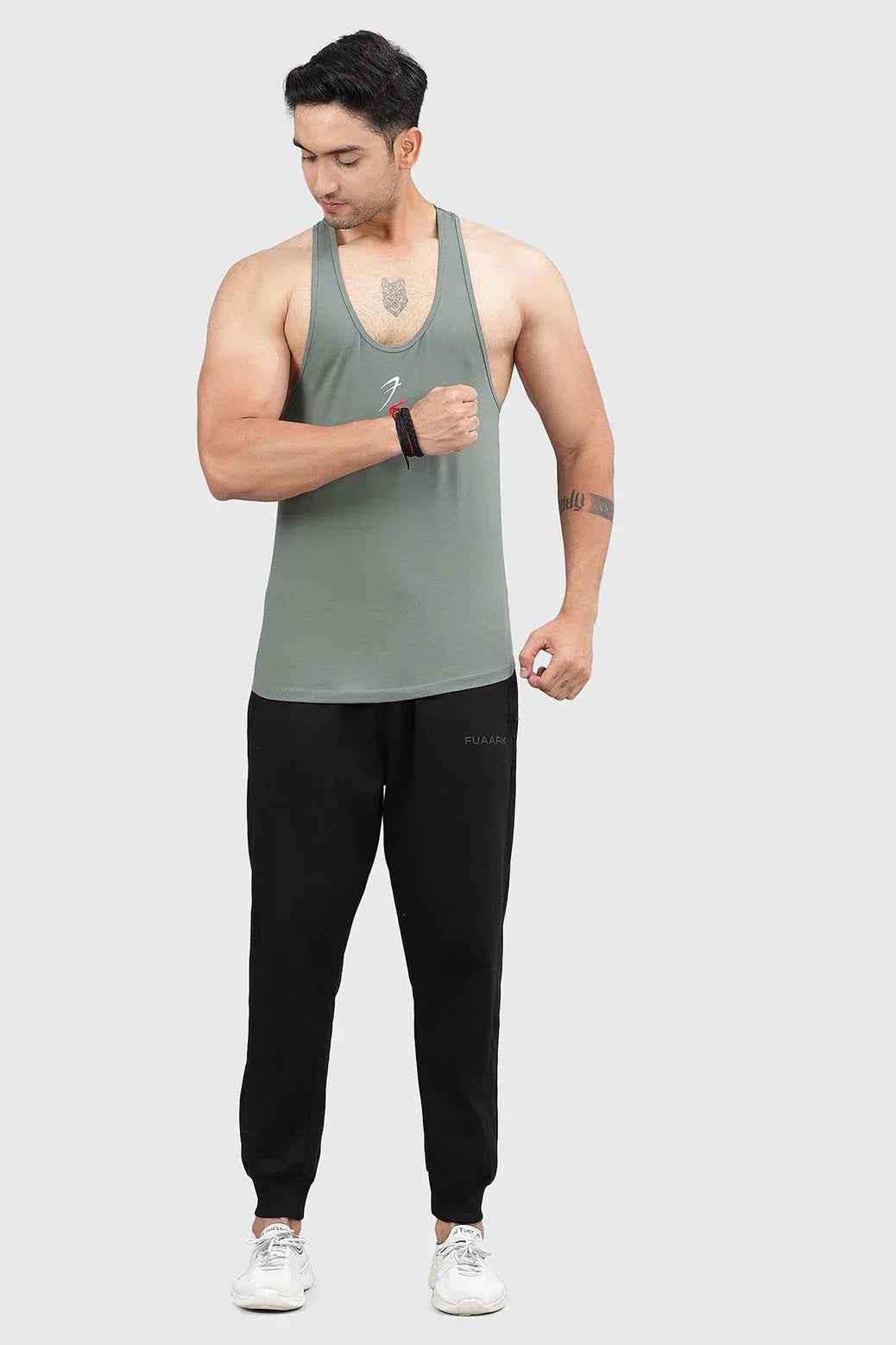 Men's sage green Fuaark Nz Legacy Stringer tank top for gym and training, showcasing slim fit and athletic design.