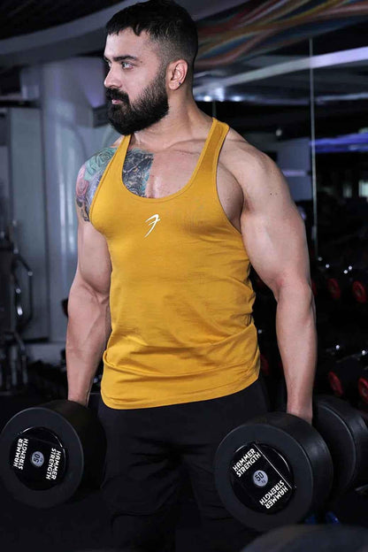 Fuaark Nz Legacy Stringer Mustard tank top displayed on a mannequin, sleeveless design, casual fit, vibrant mustard color.
