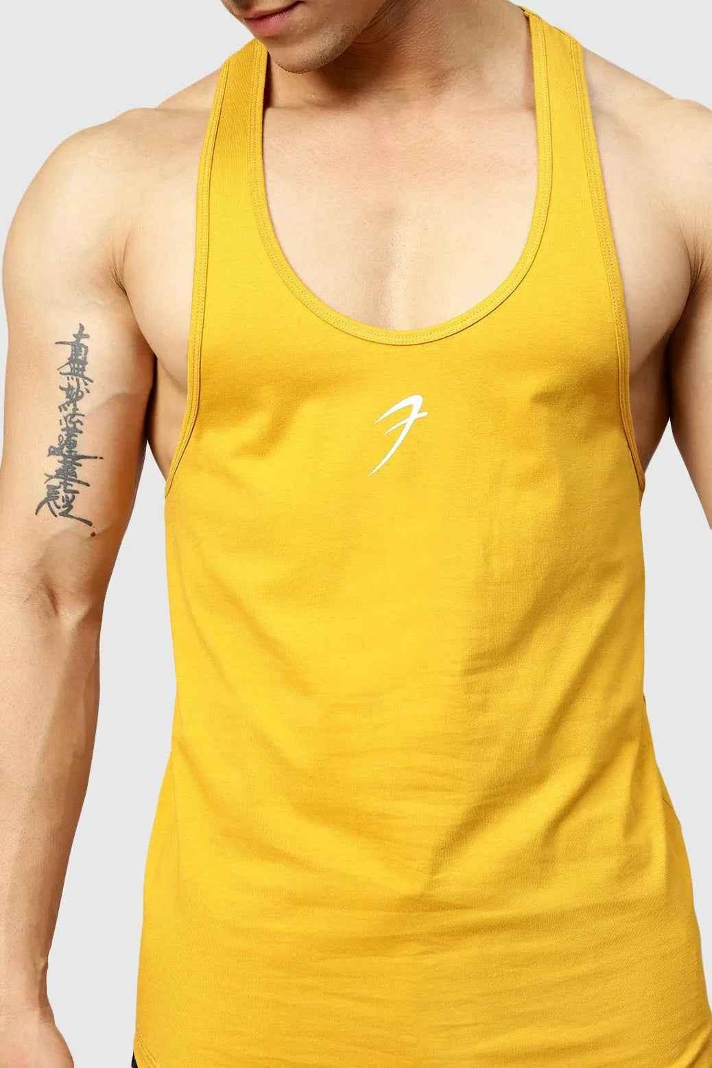 Mustard-colored Fuaark Nz Legacy Stringer Tank Top displayed on a hanger with a fitted design and sleeveless style.