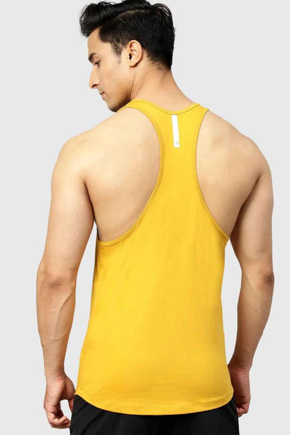 Fuaark Nz Legacy Stringer Mustard tank top shown on a hanger, featuring a vibrant mustard color and sleeveless design.