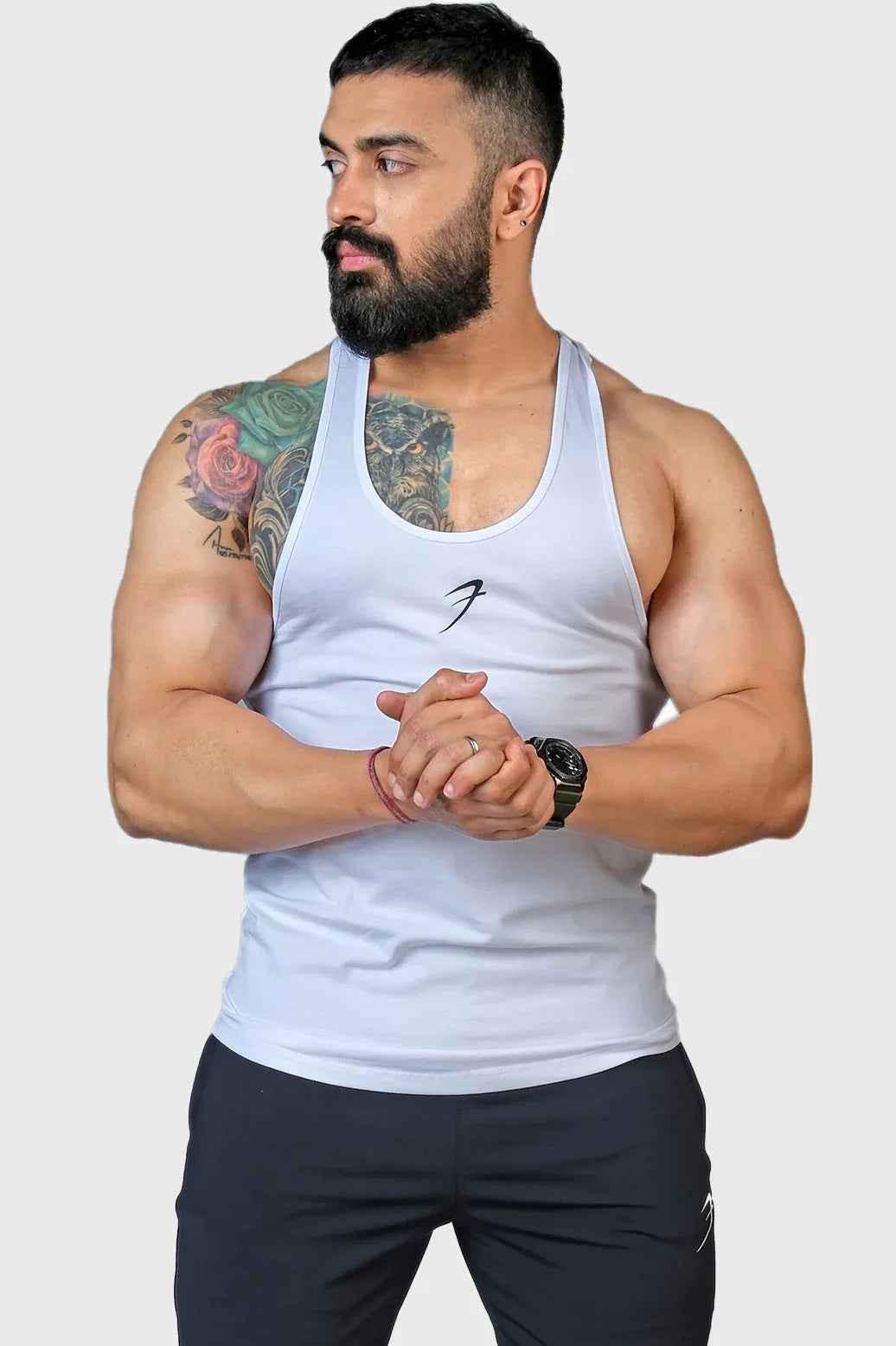 White Legacy Stringer tank top by Fuaark Nz, front view showing lightweight fabric and sleeveless design.