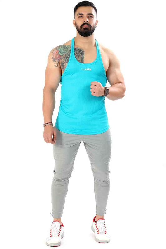 Sky blue mesh stringer tank top by Fuaark NZ, designed for comfort and style, shown on a model.