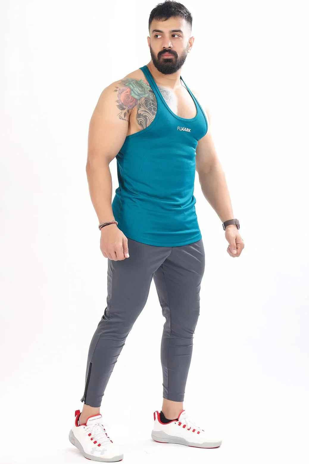 Teal mesh stringer tank top by Fuaark Nz, featuring a slim fit and breathable fabric, designed for comfort and athletic style.
